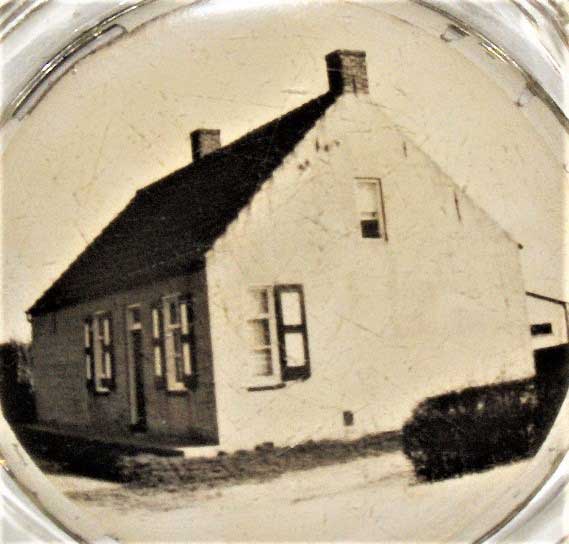 Het huis annex café van Adriaan op een asbak